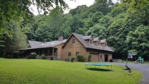 a house with a ping pong table in front of it at Eagles Nest Mansion in Montgomery