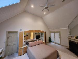 a bedroom with a bed and a ceiling fan at Eagles Nest Mansion in Montgomery