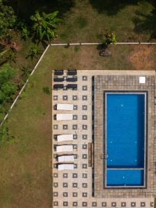 an overhead view of a building with a swimming pool at The Jungle Pearl Hotel in Udawalawe