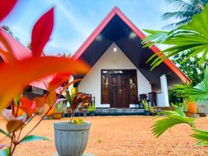 a house with a large front yard with a plant at Sigiriya On Rock Villa in Sigiriya