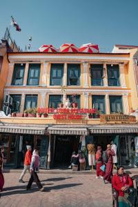 a building with people walking in front of it at Boudha Stupa View Guest House in Kathmandu