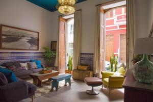 a living room with a couch and a table at Aminta Home in Las Palmas de Gran Canaria