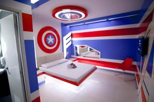 a room with a bed with a target on the wall at Astrotel Divisoria in Manila