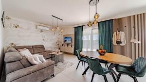 a living room with a couch and a table at Villa Antea by Villas Guide in Vela Luka