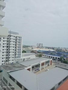 an aerial view of a city with buildings at Clover88 Studio Room is in the City but with a seaview in Mandaue City