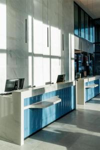 an office with a desk with two computers on it at Hyatt Place Leeds in Leeds