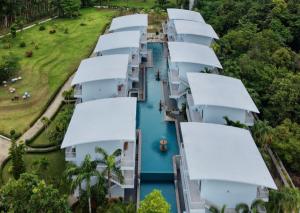 an aerial view of a row of white houses on a river at Arawan Beach Resort Krabi in Ao Nam Mao