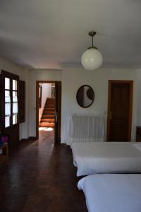 Postel nebo postele na pokoji v ubytování La Casa Del Reloj