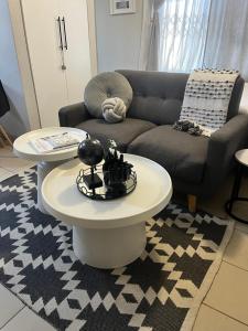 a living room with a couch and a table at B-Hive at Devland Room 3 in Soweto