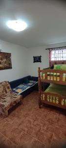 a room with two bunk beds and a couch at Apartman Jasna in Herceg-Novi