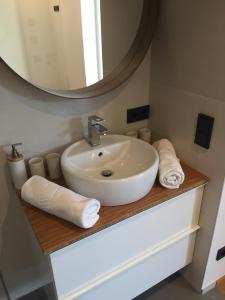 a bathroom with a sink and a mirror at Appartement Sunside in Saalbach-Hinterglemm