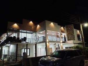 a car parked in front of a house at night at Nil Manel Tourist in Anuradhapura