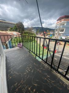 a balcony of a building with water on the ground at Budget Comfort Villas in Boragasketiya