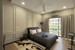 a bedroom with a bed and a window at Ayu Blue Lagoon PD by GPH in Port Dickson