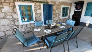 a table and chairs sitting on a patio at Villa Buby by Villas Guide in Kraljevica