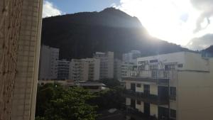a view of a mountain in a city with buildings at Copacabana Amazing Copacabana in Rio de Janeiro