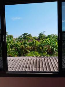 a window with a view of a roof at Krabi Hotel Agency in Krabi +31 photos
