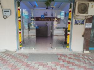 an entrance to a home store with a glass door at AB Residency in Chennai