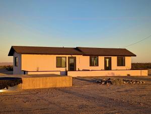a small house in the middle of a field at Golden Moon Hideaway in Twentynine Palms