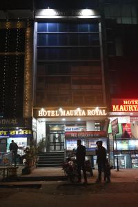 a group of people walking in front of a hotel masyka road at Maurya Royal in Sasarām