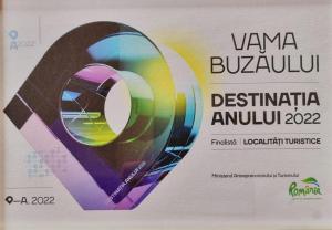 a poster for a festival with a purple ribbon at F A N BunGALow Vama Buzăului in Vama Buzăului