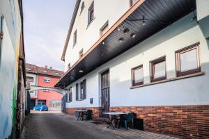 a building with a table on the side of it at Gasthaus Krone in Pforzheim