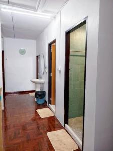 a bathroom with a glass shower and a sink at MANITA Banyainim in Krabi