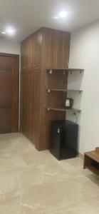 a room with wooden walls and a room with a desk at Hải Nam Hotel Tây Ninh in Tây Ninh