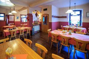 a dining room with wooden tables and chairs at Gasthaus Krone in Pforzheim