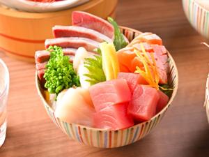 a bowl of fruit and vegetables on a table at Hotel Abest Sapporo in Sapporo