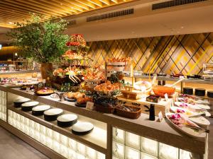 a buffet line with many different types of food at Hotel Abest Sapporo in Sapporo