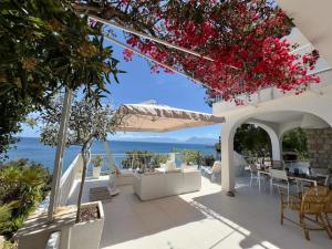 a patio with a view of the ocean at Sicily Sea Villa Capo Zafferano in Santa Flavia