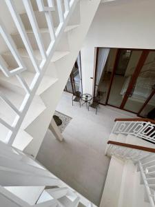 a view of a room with white ceilings at Ramady Guest House in Tumbak Bayuh
