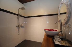a bathroom with a bowl sink and a shower at Selau Asry in Sidemen +13 photos