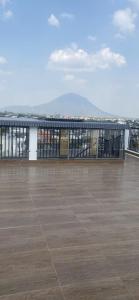 a balcony with a view of a mountain in the distance at Hải Nam Hotel Tây Ninh in Tây Ninh