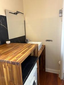 a small kitchen with a sink and a washer at Le charme de Collioure in Collioure +5 photos