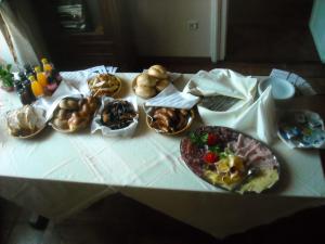 a table with many different types of food on it at Guest House Čater in Laško +33 photos
