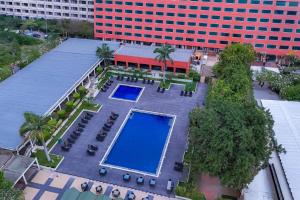 an overhead view of a building with a swimming pool at Abuja Continental Hotel in Abuja