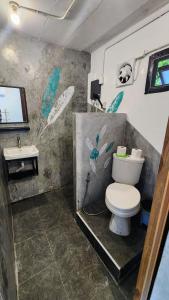 a bathroom with a toilet and a sink at Feel home Private Studio in Ko Phangan +5 photos