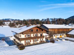 an aerial view of a house in the snow at Bauernhof Grafenhof in Ebbs