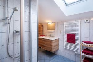 a bathroom with a sink and a shower at Bauernhof Grafenhof in Ebbs +22 photos