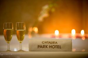 two glasses of champagne on a table with a napkin at Chtaura Park Hotel in Chtaura +51 photos