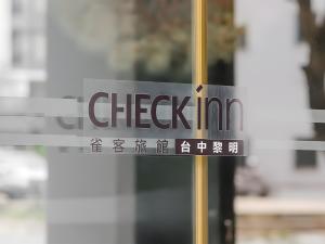 a sign on the window of a store at CHECK inn Taichung Liming in Taichung