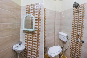 a bathroom with a toilet and a sink and a mirror at RROOMS Elite Hotel Kanha Cassic in Kānpur