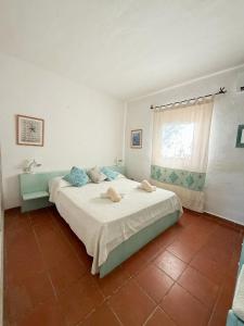 a bedroom with a large bed and a window at Appartamenti sul mare in Santa Marinella