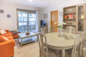 a living room with a table and a couch at Casa Alicia Altea By DelucaCo in Altea