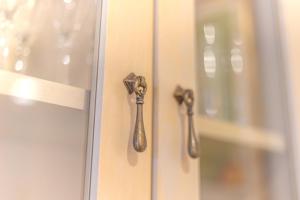 a pair of door handles on a glass door at Casa Alicia Altea By DelucaCo in Altea +38 photos