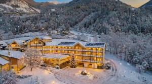 an aerial view of a hotel in the snow at Erlebnishotel Kärnten-Mölltal 3 Stern Superior in Obervellach