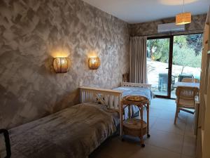a bedroom with a bed and a table in it at La Única in Coín