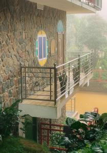 a staircase on the side of a building at Vaga Copper Castle in Vagamon